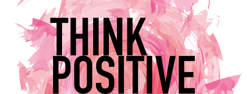 Symbolbild Positivität: Spruch "Think positive" auf pinkem Hintergrund